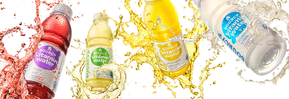 Drinks packshots photography of four Sourcy vitamin water bottles splashing made by Studio_m Photography Amsterdam