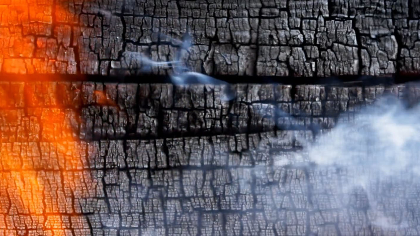 a video still of smoking and burning for flame grilling burgers