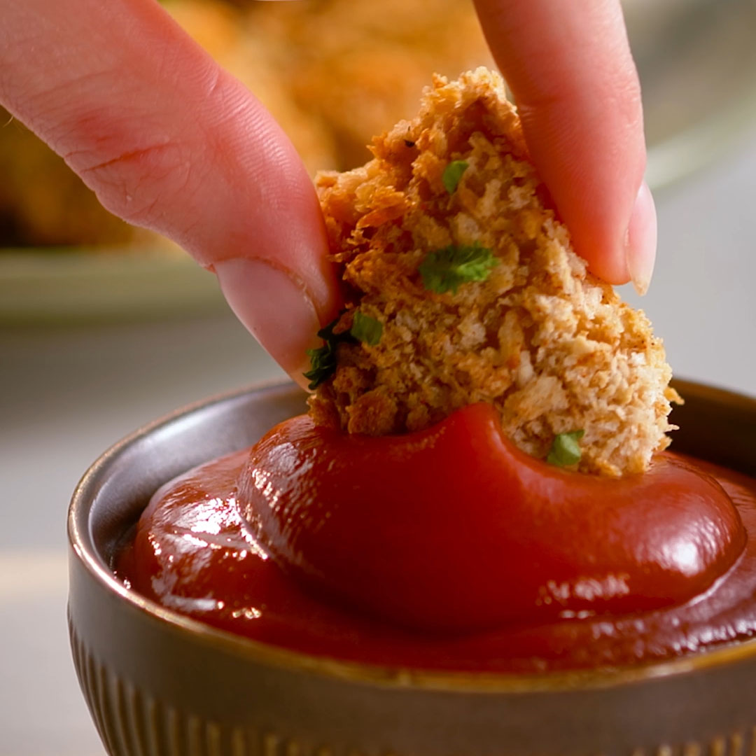 recipe video still of plate of pumpkin fries with Heinz pickled ketchup bottle in background